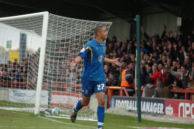 Signing off in style: Byron Harrison celebrates his goal against Shrewsbury