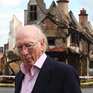 Your Local Guardian: Maurice Reeves outside his store which was destroyed during last summer's riots