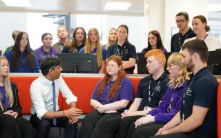 Prime Minister Rishi Sunak speaking to students and teachers including Jennifer Hughes during a visit to Cannock College (Stefan Rousseau/PA)