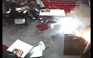 CCTV captured the moment a firework was hurled into Chicken Cottage in Wimbledon last week