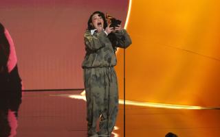 Lola Young accepts the award for best pop solo performance for 