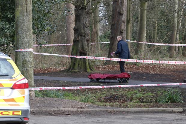 Police were called at 7.40am after a body was spotted near a car park