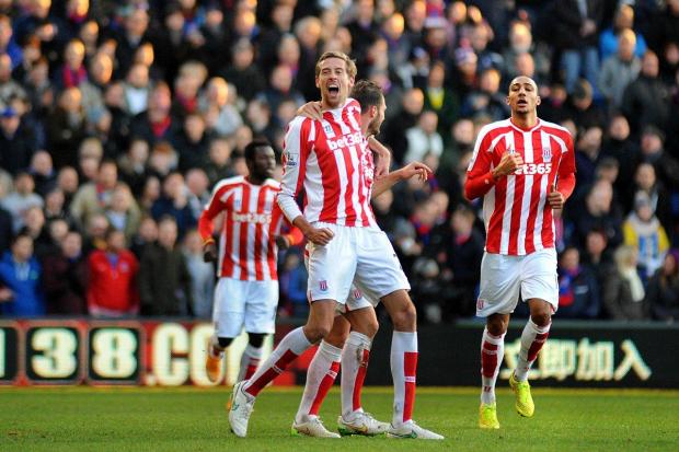 Battle royal: Peter Crouch & Co have adopted boss Mark Hughes' combative approach with relish