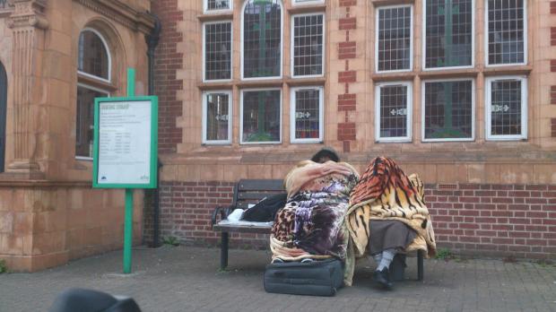 The homeless family were seen sleeping outside Tooting library last night
