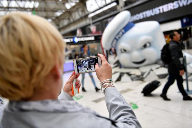 VIDEO AND PICTURES: Commuters come face-to-face with Ghostbusters’ Mr Stay Puft at Waterloo station