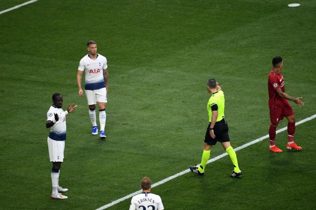 Tottenham Hotspur's Moussa Sissoko (left) concedes a penalty resulting in the opening goal scored by Liverpool's Mohamed Salah during the UEFA Champions League Final at the Wanda Metropolitano, Madrid.