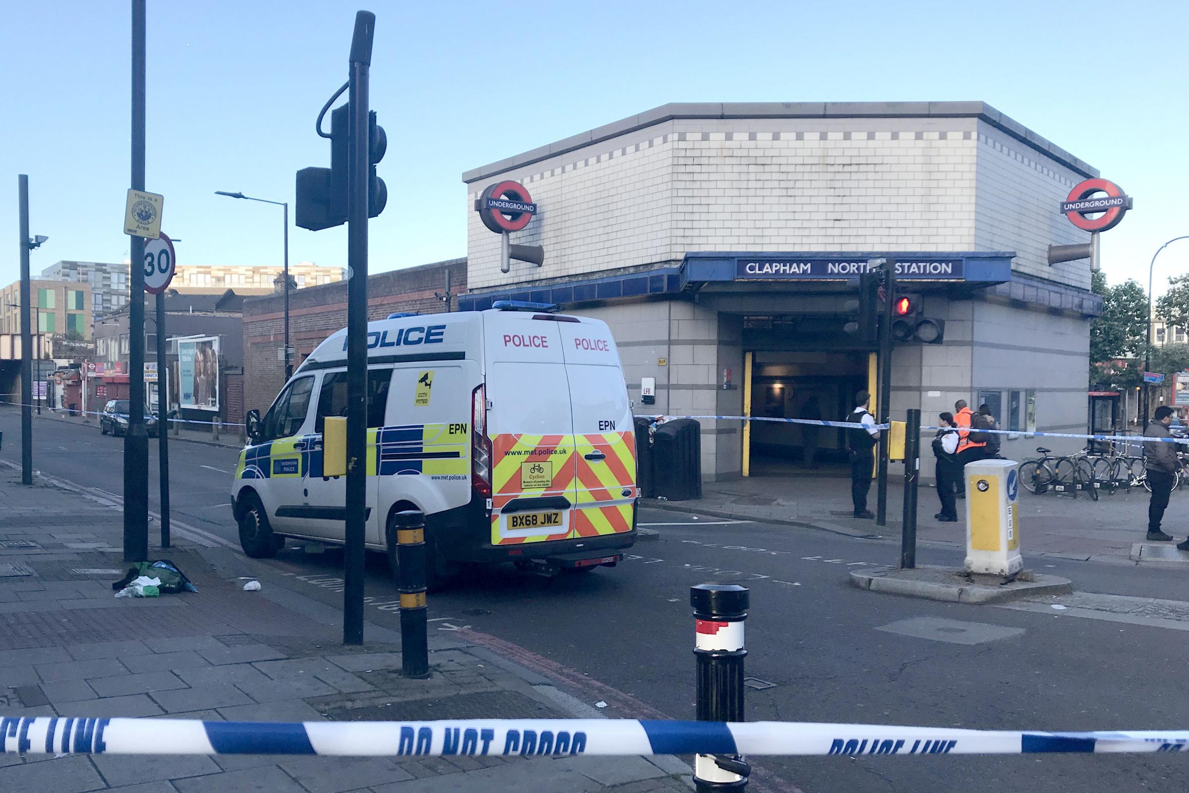 Three men found with stab and slash wounds in Clapham